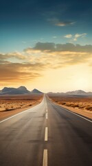 A long road with mountains in the background