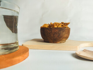 photography of cimi-cimi snacks with a glass of water