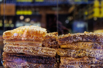 Honeycomb with honey in closeup on market