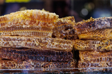 Honeycomb with honey in closeup on market