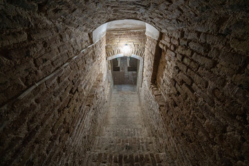 Obraz premium Vaulted stairway leading to the crypt of the Aksaray Mausoleum built in the 15th century under the Timurid Empire in Samarkand, Uzbekistan, Central Asia