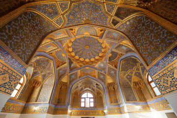 Fototapeta na wymiar Ornate ceiling of the Aksaray Mausoleum built in the 15th century under the Timurid Empire in Samarkand, Uzbekistan, Central Asia