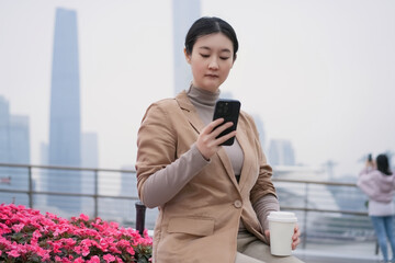 Young Professional Woman Using Smartphone Outdoors
