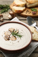 Fresh homemade mushroom soup served on wooden table