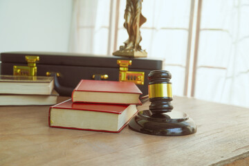 A symbolic image of a wooden gavel, representing law and judgment. With a white background, it...