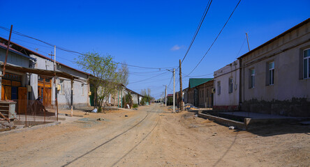 Poor street in a residential neighborhood of the city center of Nukus, the capital of Karakalpakstan in western Uzbekistan, Central Asia