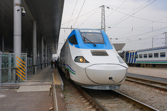 Afrosiyob high-speed train in Uzbekistan, as seen at Samarkand's train station - Spanish manufactured Talgo 250 electric locomotive operated by Uzbekistan Railways on the Tashkent-Bukhara line