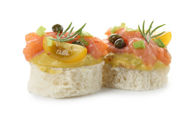 Tasty canapes with salmon, tomatoes, capers and herbs isolated on white