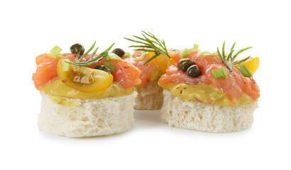 Tasty canapes with salmon, tomatoes, capers and herbs isolated on white