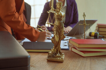 A group of lawyers and clients engage in a professional meeting at a law office, discussing agreements, contracts, and legal matters with a focus on justice and expert advice.