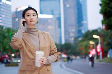 Professional Woman on Phone Call During City Commute