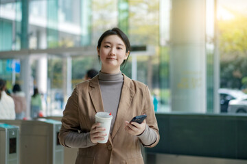 Confident Businesswoman with Coffee on-the-go