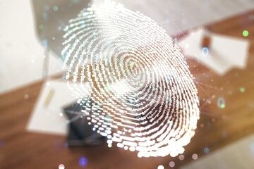 Multi exposure of creative fingerprint hologram and modern desktop with laptop on background,...