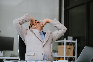 Businessman talking on the phone arguing laptop computer problems highlighting customer...