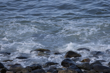 Ocean waves crashing on a rocky shore
