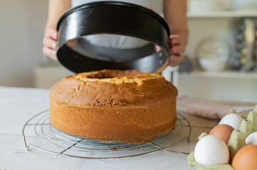 Fresh baked bundt cake upside down on a cooling grid or cooling rack in the kitchen