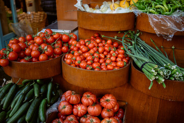 Vegetables on a market counter. Tomatoes, onions, peppers and cucumbers. High quality photo