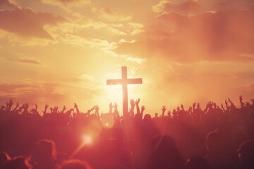 A crowd of various people are raising their two hands to the air to praise the Lord and  gathered around a wooden cross settled at a mound among the cloudy sky. Religion and faith in God.
