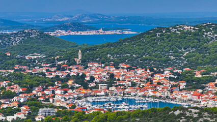 AERIAL: Picturesque view of two quaint old towns on the coasts of Hvar island. - obrazy, fototapety, plakaty