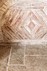 Detail of tiled surface in ancient fireplace