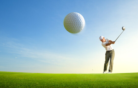 Close-up golf ball after golfer hitting with driver.