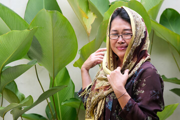 Close up shot of Javanese woman in her traditional clothes, called Kebaya