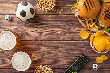 Soccer championship concept. Top view photo of fried snacks for football fans, mugs of beer, soccer...