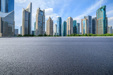 Asphalt road and modern urban commercial buildings scenery in Shanghai. Famous city landmarks in China.