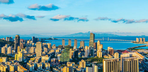 Aerial view of beautiful coastline and modern city buildings landscape at sunset in Zhuhai....