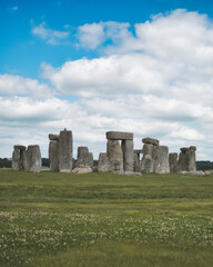 STONEHENGE, WILTSHIRE - JUNE 25 2021: Tourists amongst the standing stones on JUNE 25 2021 in...