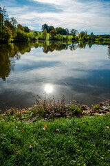 Meadow sun and lake scenery landscape