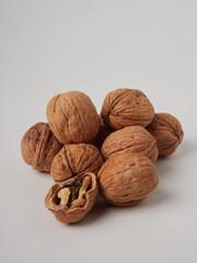 walnut and a cracked walnut isolated on the white background