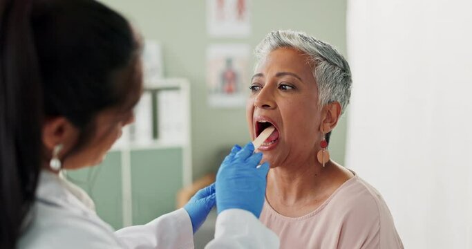 Clinic, doctor and exam woman, tongue depressor and spatula to check patient, assessment and health. Professional, female person and worker for healthcare, mouth and inspection, medical and care