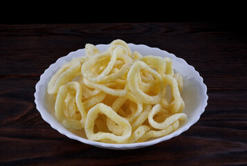 White bowl with onion ring chips