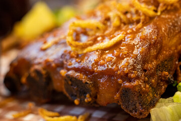 pork thighs in sauce with salad, arugula. view from above