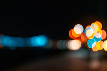 Unfocused blurred photo of city lights in the dark at night.