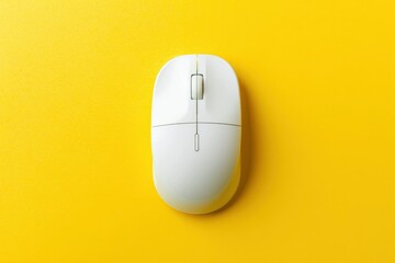 Top view of a white computer mouse on a yellow background