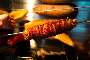 Turkish Street Food Kokoreç rolls are made by cooking lamb intestines over wood fire.