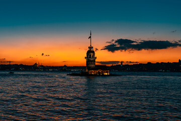 Fiery sunset over the Bosphorus with the famous Maiden's Tower, the symbol of Istanbul. Wallpaper...