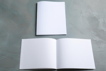 Open and closed blank brochures on grey background, top view. Mock up for design