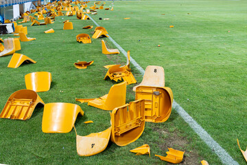 broken plastic seats after match on stadium