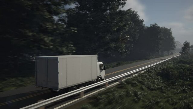 Cargo express delivery vehicle moving on the highway surrounded by green forest. Cargo express delivery truck transporting the products. Quick Express delivery of the cargo on the freeway.