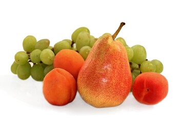 Naklejka na ściany i meble fresh apricots, pear and grapes on a white background