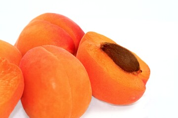 juicy fresh apricots on a white background