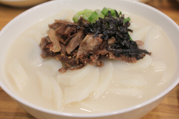 sliced rice cake soup on a bowl