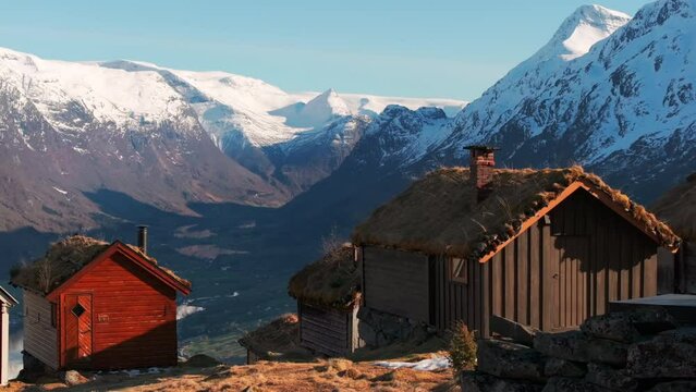 Drone reveal majestic Loen glacier sunset view from old Norway hilltop village