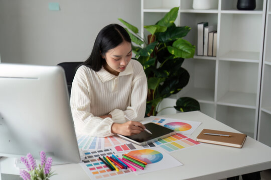 Asian woman graphic designer working in home office. Artist creative designer illustrator graphic skill concept