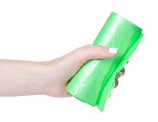 Green garbage bags in hand on white background isolation