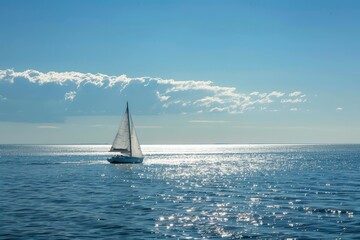 Obraz premium Sailing boat on sunny sea