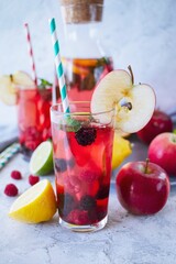 A refreshing summer sangria with fresh berries, apples, raspberries and lime.